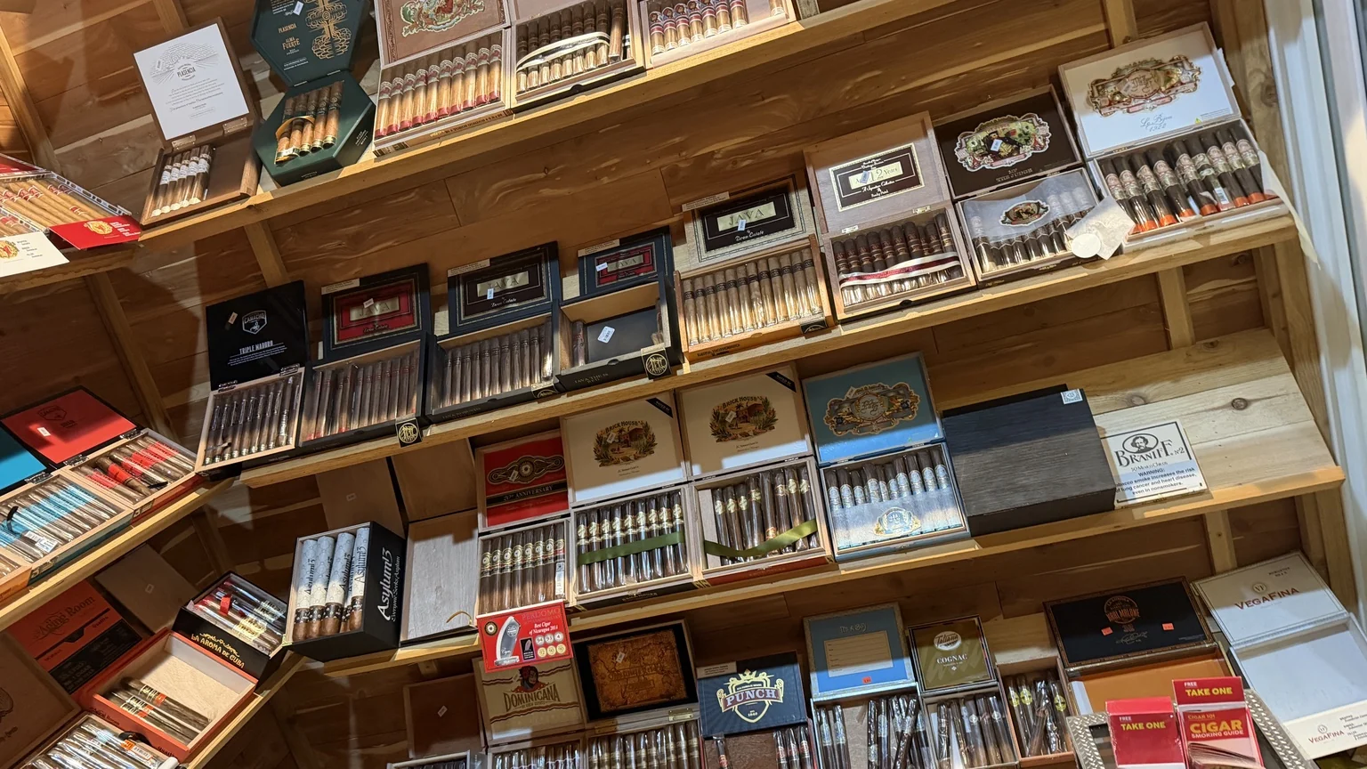 Premium cigar boxes and cigar selection displayed inside Julian Tobacco & Vape in Arden NC