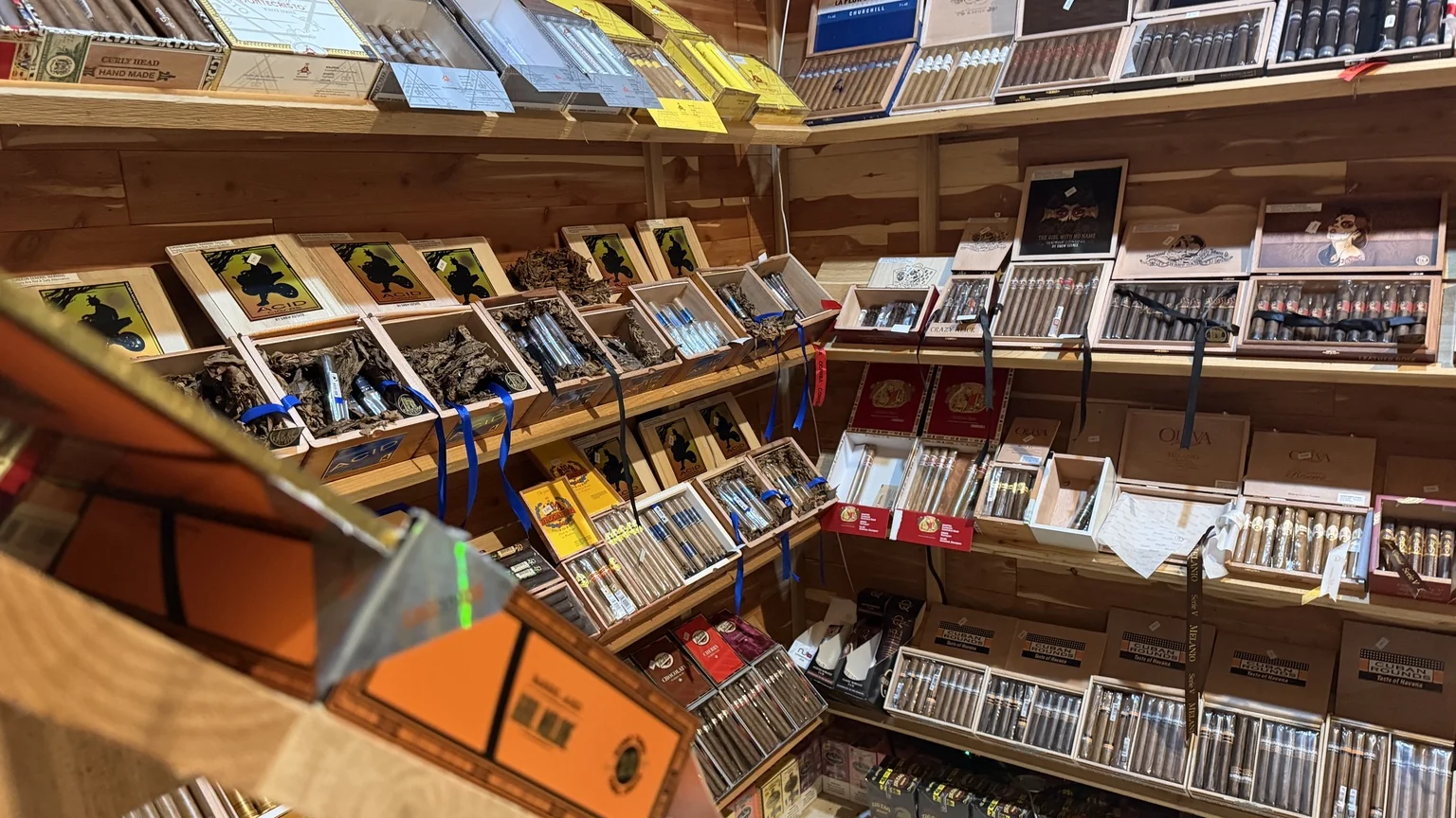 Wide view of the dedicated cigar retail selection inside Julian Tobacco & Vape